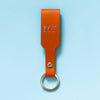 Personalisierter Schlüsselanhänger in Orange aus Premium Leder mit Initialen Prägung in Silber 