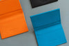 Mini Geldbörse in Orange, Blau und Schwarz aus Nappaleder mit Kartenfach und Scheinfach
